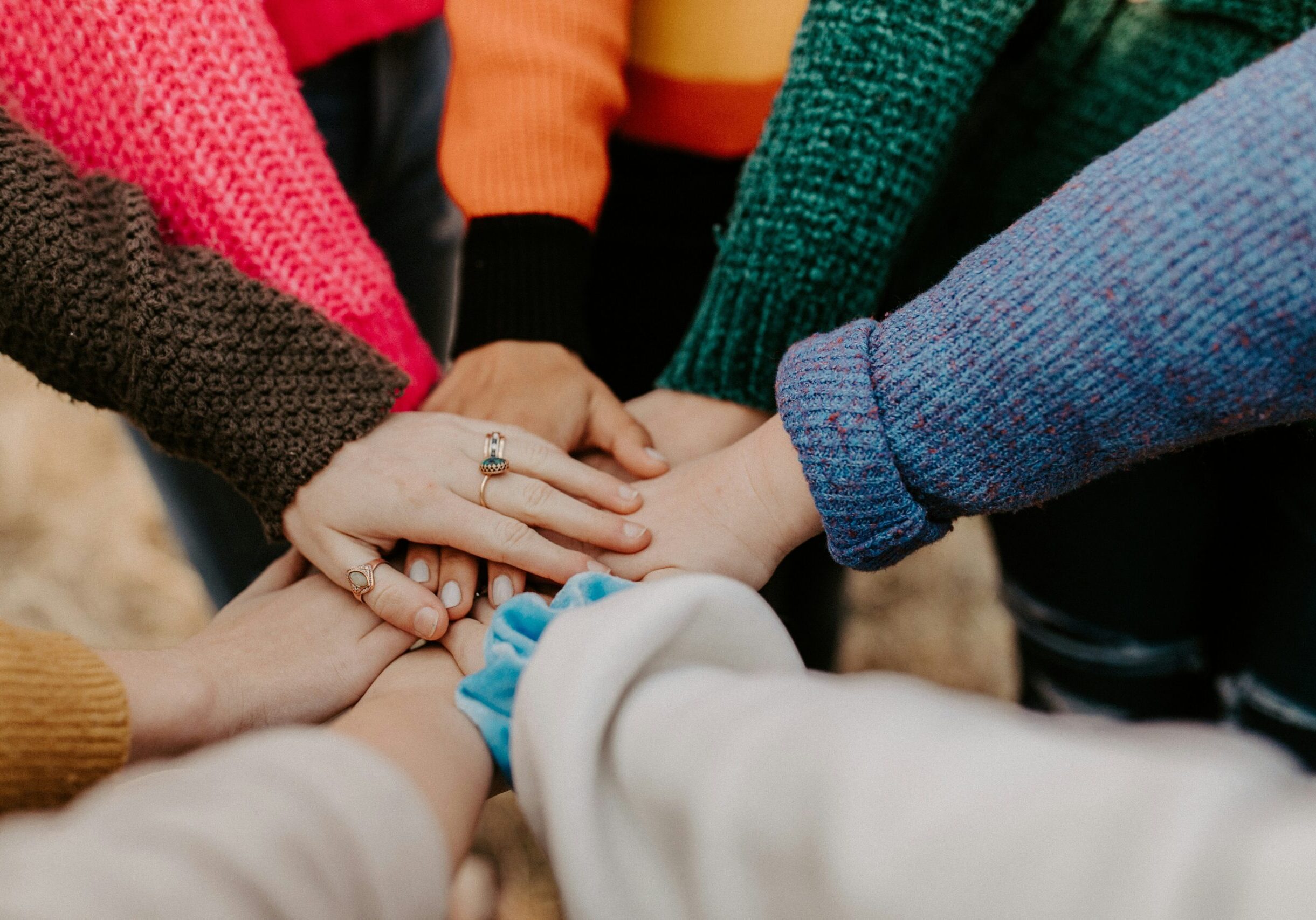 image shows many hangs supporting each other